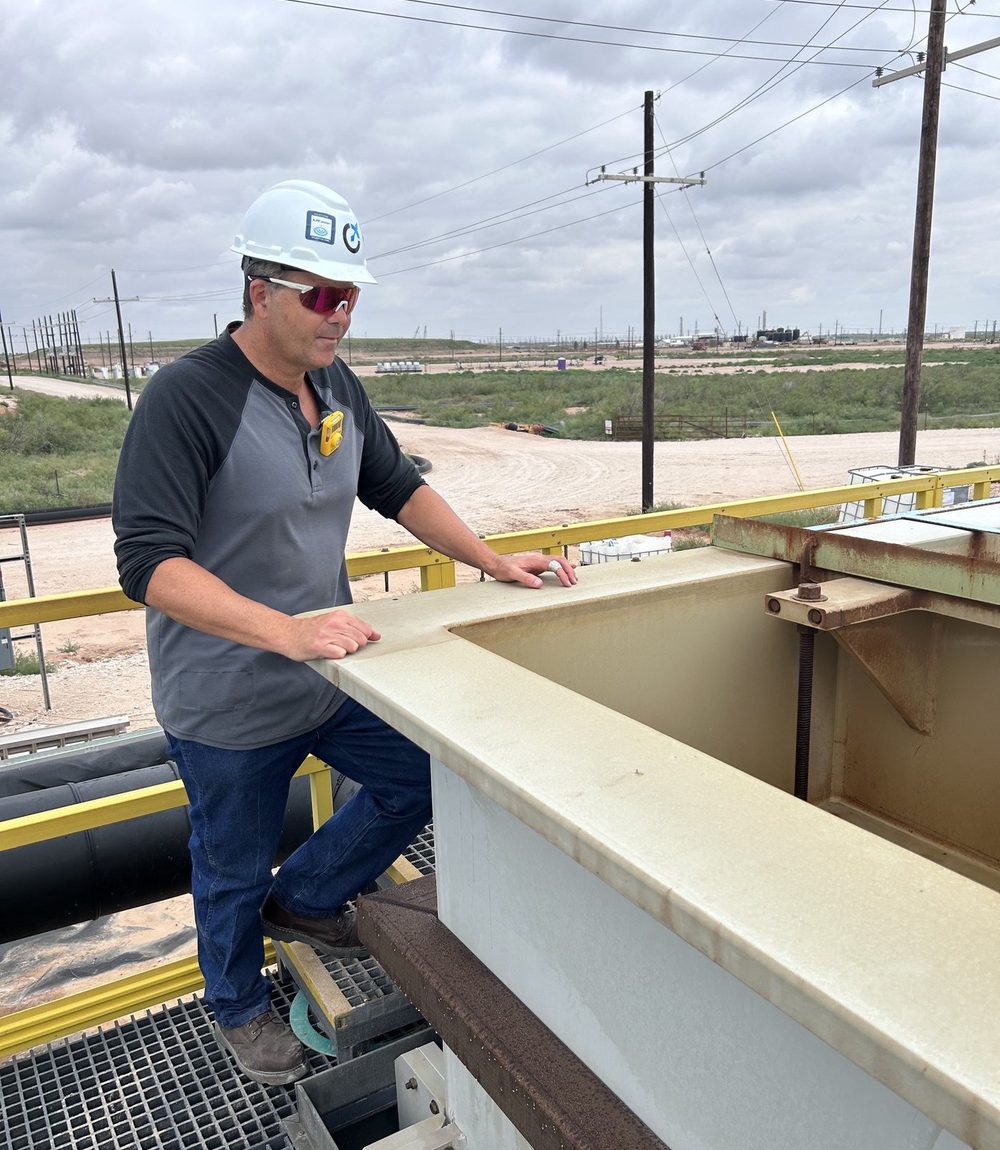 Ivan Sager on the catwalk of a treatment unit in the Permian Basin.