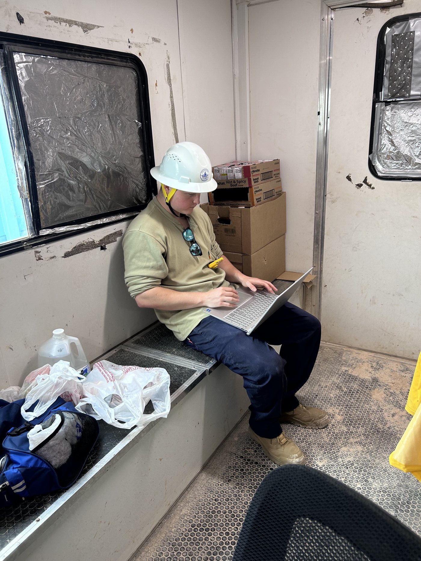 Ryan working from the field trailer
