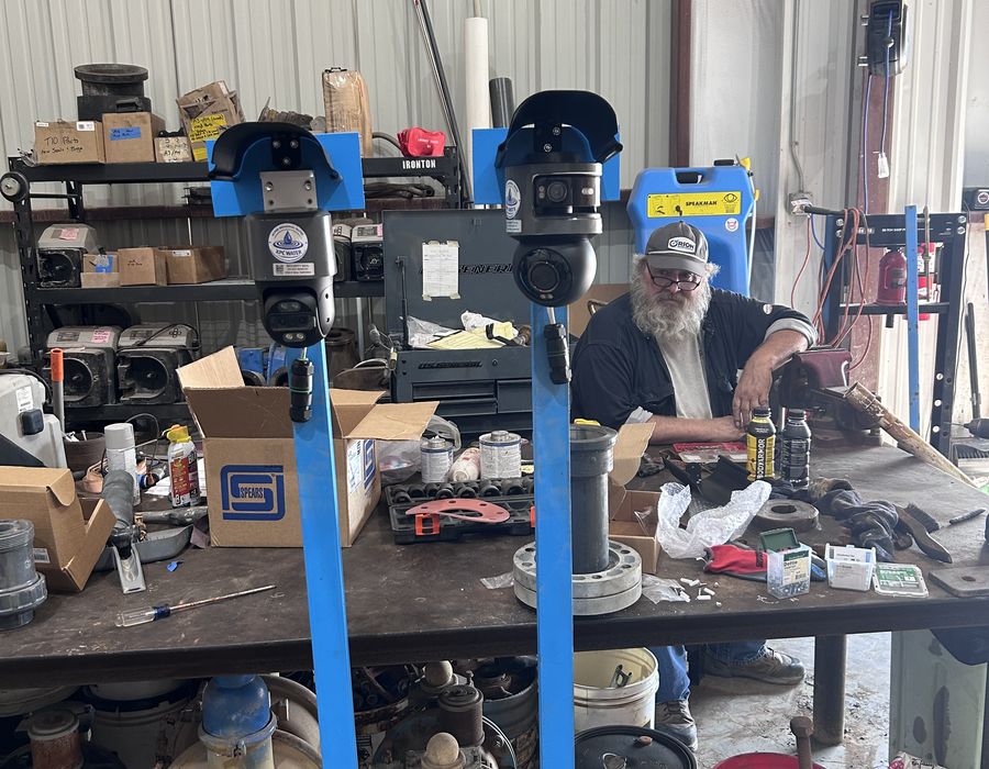 Mounting AI cameras on site with Jim.